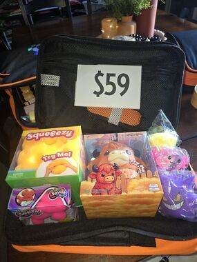 New  Black/Orange Case With Squishies.  $125 VALUE.
